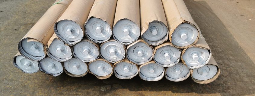 Wrapped roller assemblies in the GRAM ceramic range with circular end plates and projecting shaft ends visible