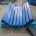 Conveyor load-zone impact bed with longitudinal bars and inclined side supports