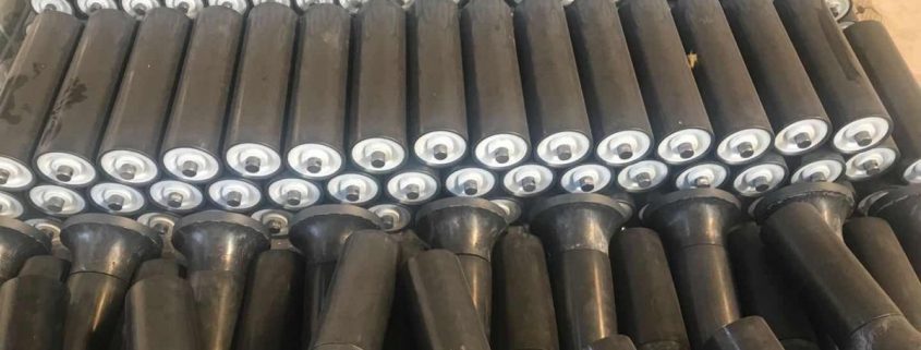 Polymer conveyor roller assemblies with metal shaft ends