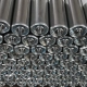 Steel roller assemblies with cylindrical bodies, bearing ends and projecting shafts