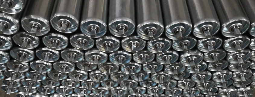 Steel roller assemblies with cylindrical bodies, bearing ends and projecting shafts