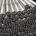 Steel conveyor rollers stacked with bearing ends and shaft interfaces visible